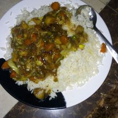 A picture of White rice n sauce.
