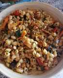 Wok de pasta lumaconi o caracolas con verduras