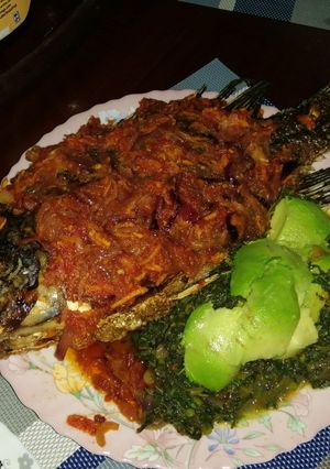 A picture of Juicy wet fry fish with ugali.