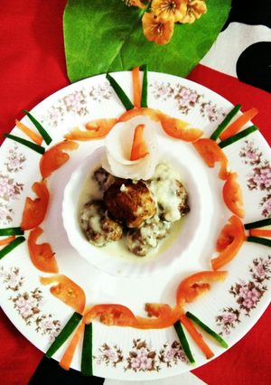 A picture of Rice fish ball in white sauce.