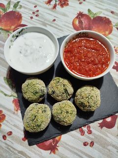 A picture of Kale & Red Lentil Bites with Two Sauces.