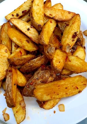 A picture of My salt pepper & Chilli Wedge Chips 😅.