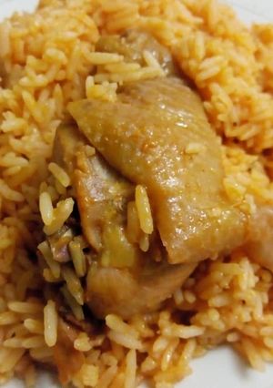 A picture of Jollof rice with fried chicken.
