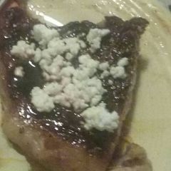 A picture of NY Strip with Feta & Balsamic Vinegar Reduction .