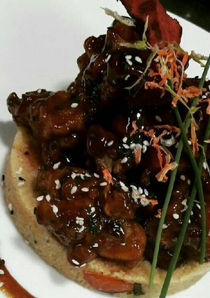 A picture of Glazed chicken drumstick on Cous Cous.