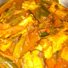 A picture of Fish curry with brinjal.