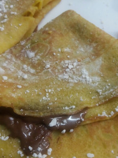 Una foto de Crepes de naranja rellenas de nutella