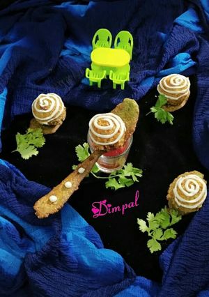A picture of Oats daliya balls loaded with oats palak spoon.