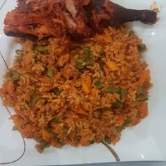 A picture of Jollof rice and chicken.