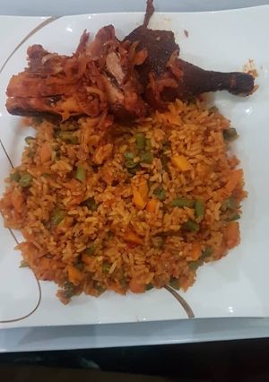 A picture of Jollof rice and chicken.