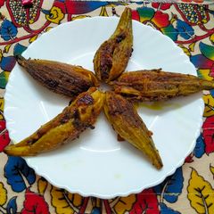 A picture of Raw mango with spices stuffed karela.