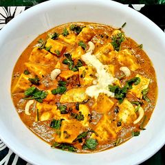 A picture of Paneer Butter Masala with fresh cream.