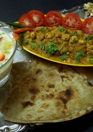 A picture of Pineapple basundi,mava makhana,parantha with salad.