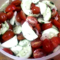 A picture of Cucumber Tomato Salad with Lemon Chia Seed Dressing.