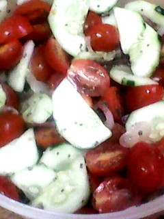 A picture of Cucumber Tomato Salad with Lemon Chia Seed Dressing.