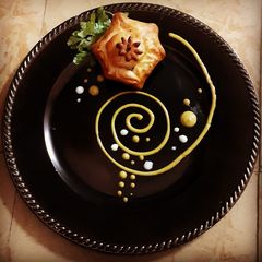 A picture of Chicken Bun with honey mustard sauce.