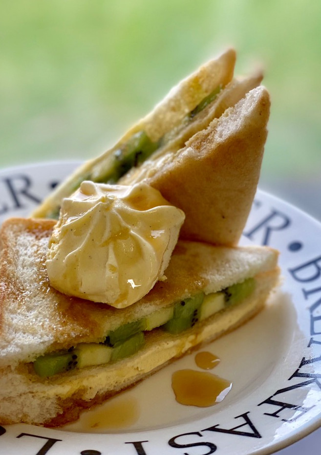 A picture of Maple Bread Toast with Kiwi and Vanilla Ice Cream.