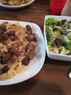 A picture of Beef and Noodles with Spring Salad.