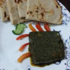 A picture of Sarsoon ka saag with chawal ki rotti.