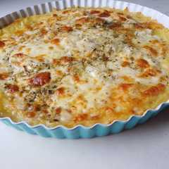 Una foto de Tarta con masa de Papa de Provolone y Cebolla