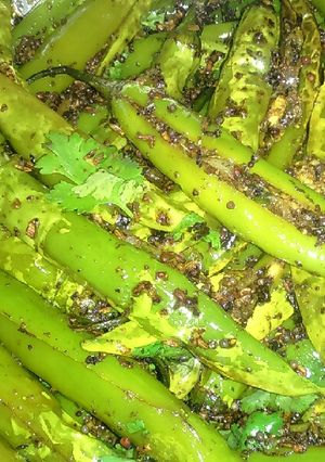 A picture of Fried masala green chillies.