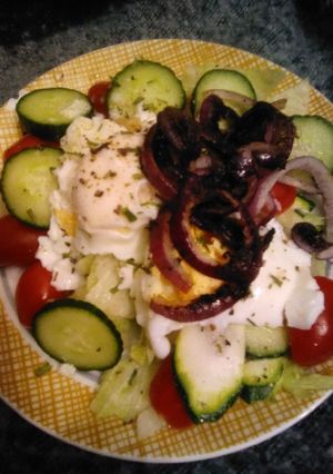 A picture of Poached eggs on salad.