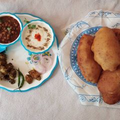 A picture of Banana flavoured bhatura with chatpate aloo and spicy chana.