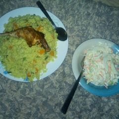 A picture of Fried rice and salad.