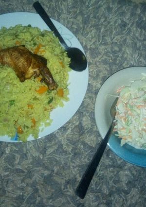 A picture of Fried rice and salad.