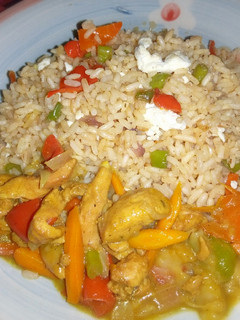 A picture of Chinese rice with chicken curry soup.