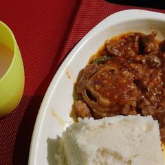 A picture of Stewed Goat With Ugali.