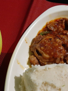 A picture of Stewed Goat With Ugali.