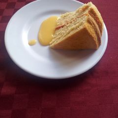 A picture of Victoria sandwich with custard sauce.