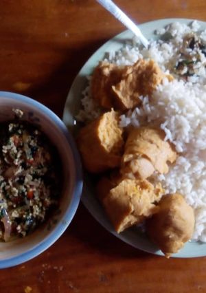 A picture of Rice and moimoi with vegetable egg sauce.