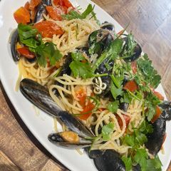 A picture of Spaghetti of tomato and mussels.