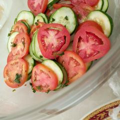 A picture of Tomato and cucumber salsa.