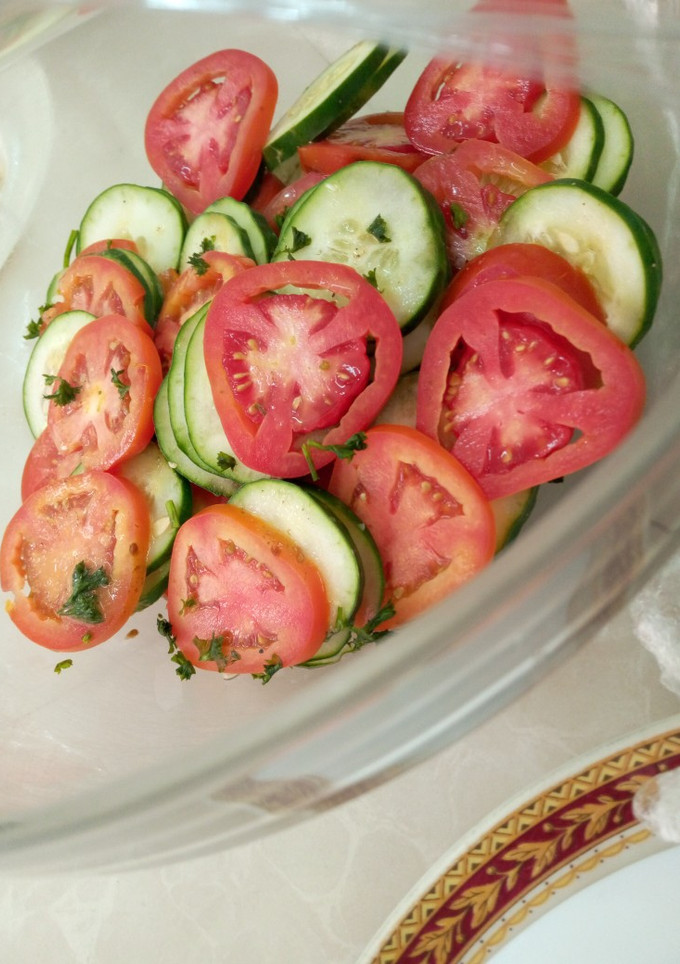 A picture of Tomato and cucumber salsa.