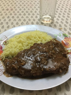 Una foto de Chuleta de cerdo en salsa agridulce de limón y jengibre
