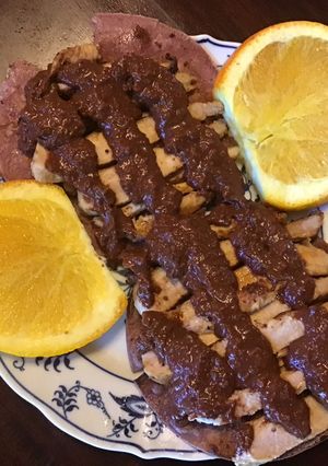 A picture of California Farm Pork Chops Mole Sauce Tortillas.