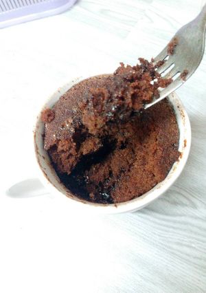 A picture of Microwaved lava cake in mug.