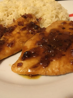 Una foto de Pollo al ron con miel y naranja