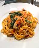 Seafood tomato cream pasta with kale