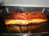 Trozo de panceta al horno con macerado de cítricos