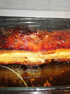 Una foto de Trozo de panceta al horno con macerado de cítricos