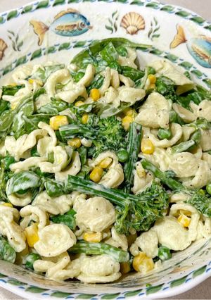A picture of Broccolini and orecchiette with yoghurt and peas.