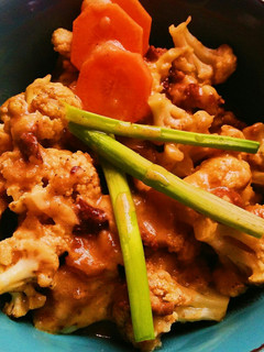 A picture of Sweet and spicy cauliflower with creamy custard sauce.