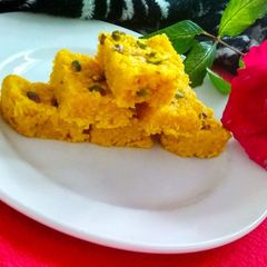 Mango flavour coconut burfi A picture of Mango flavour coconut burfi.