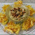 Nidos de patatas fritas y mejillones en salsa