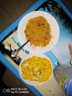 A picture of Spaghetti served with omlette.