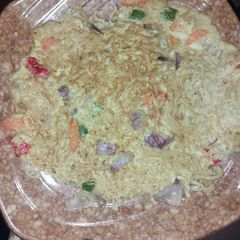 A picture of Fried indomie with egg and vegetables.